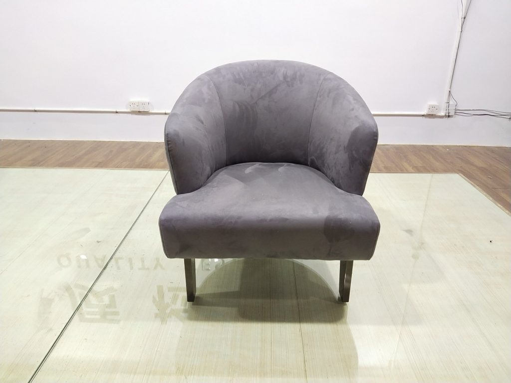Front view of a custom upholstered accent chair made for the Dubai hotel project.