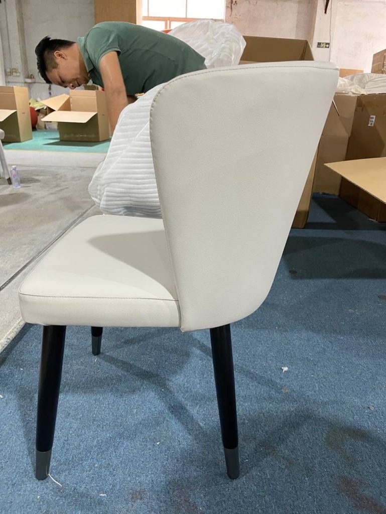 Titanium-black decorative detail on a custom dining chair for the Dubai hotel project.