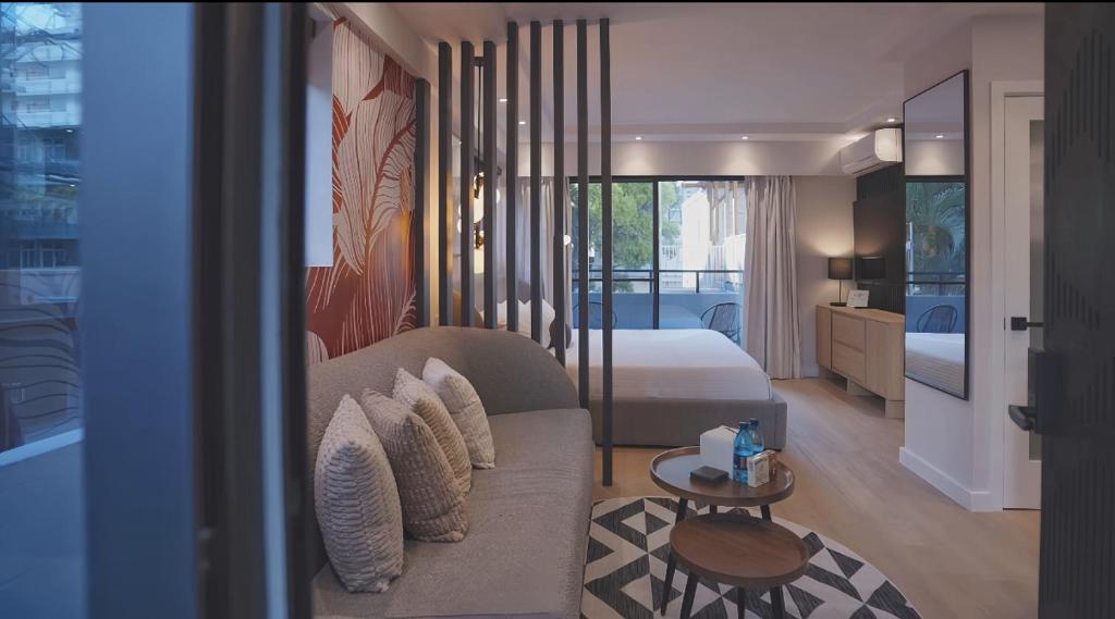 Hawaii hotel guest-room renovation with custom sofa bed and bed arrangement.