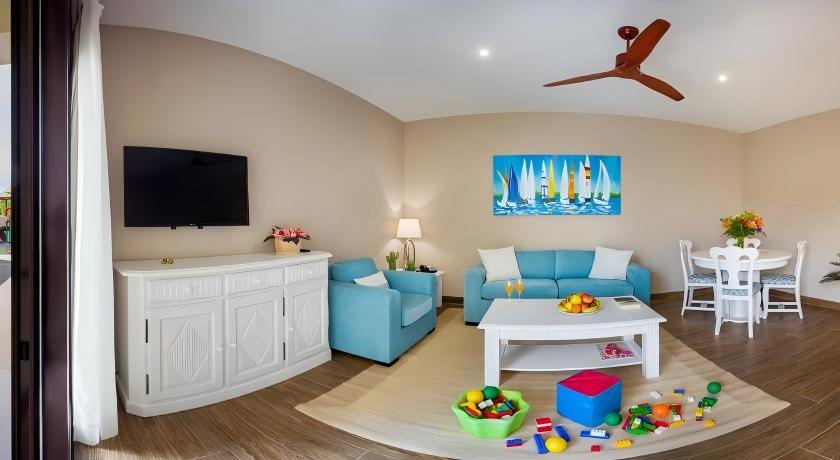 Hotel family room in Lanzarote furnished with a custom sofa bed and lounge chair.