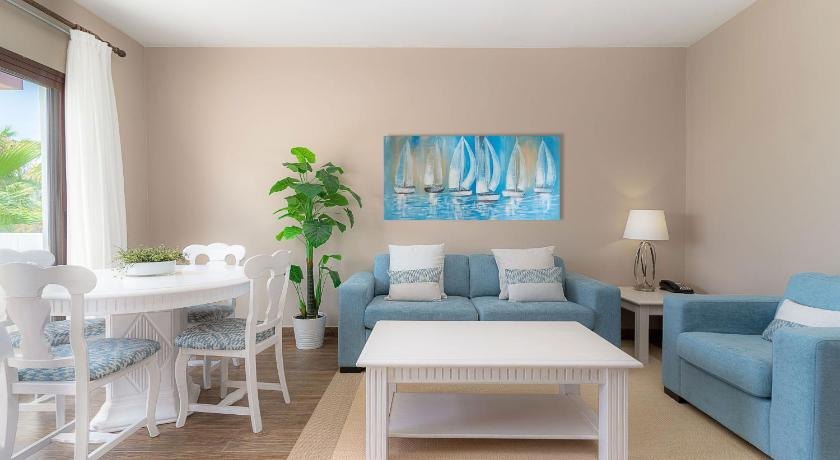 Completed hotel interior in Lanzarote with a sofa bed and coordinated lounge chair.