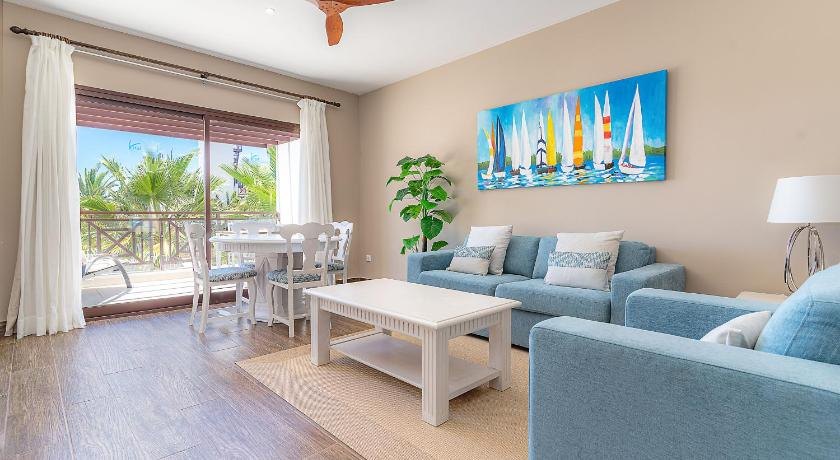 Completed Lanzarote hotel room with a blue custom sofa bed and matching lounge chair.