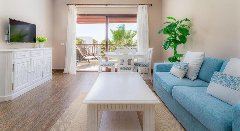 Custom blue sofa bed installed in a Lanzarote hotel guest room in Spain.