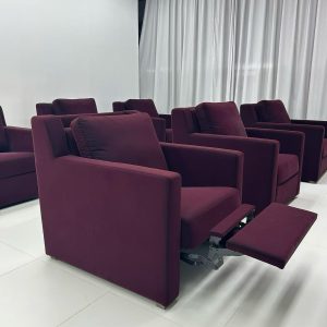 HT-1 commercial reclining lounge chair with upholstered seat and pull-out footrest