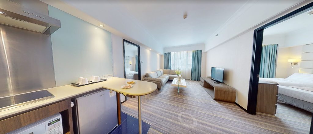 Hong Kong hotel suite with custom L-shaped sofa