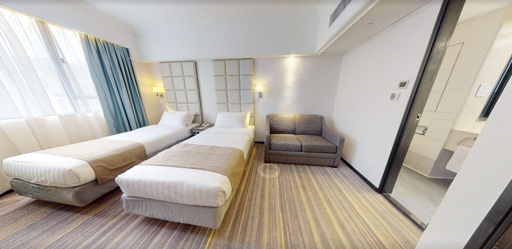 Hong Kong hotel twin guest room with custom sofa