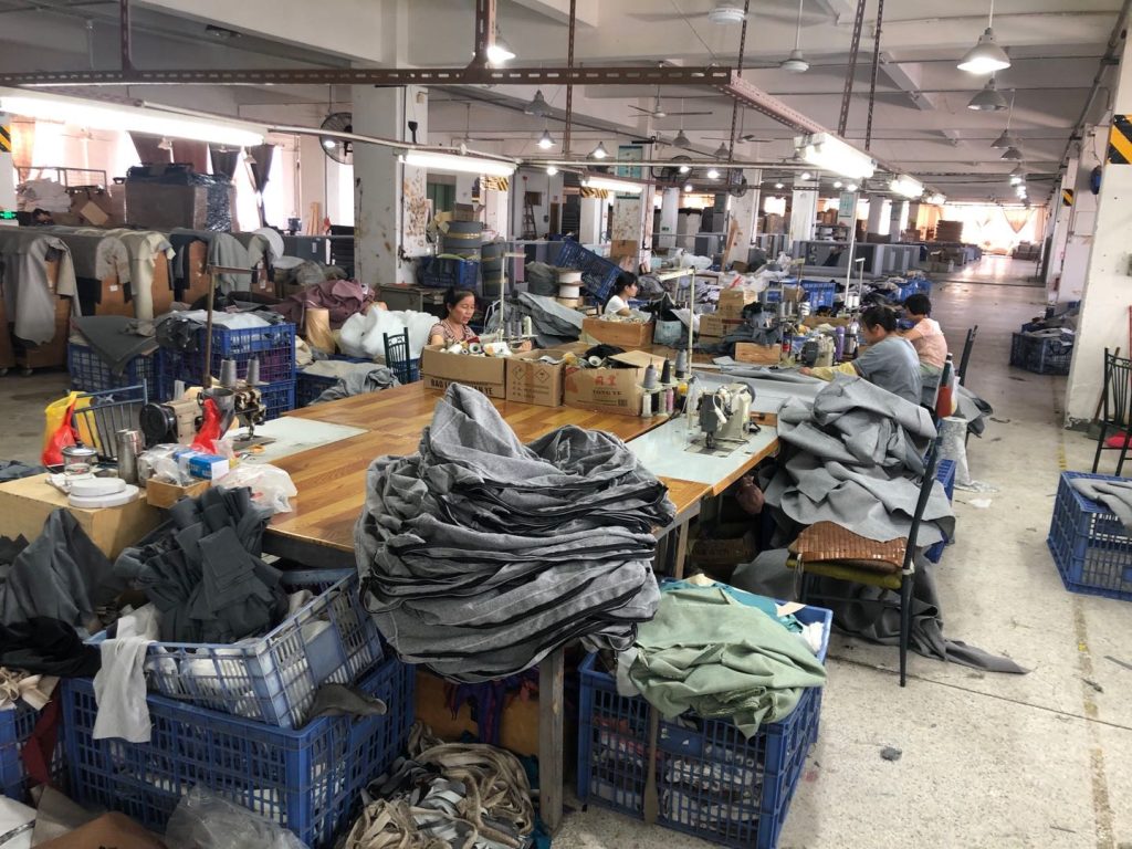 Sewing workstations preparing upholstery covers for a Canadian hotel project