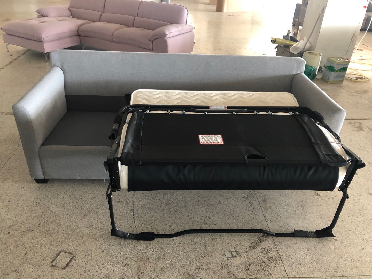 Sofa-bed mechanism and mattress components shown during Canadian hotel production