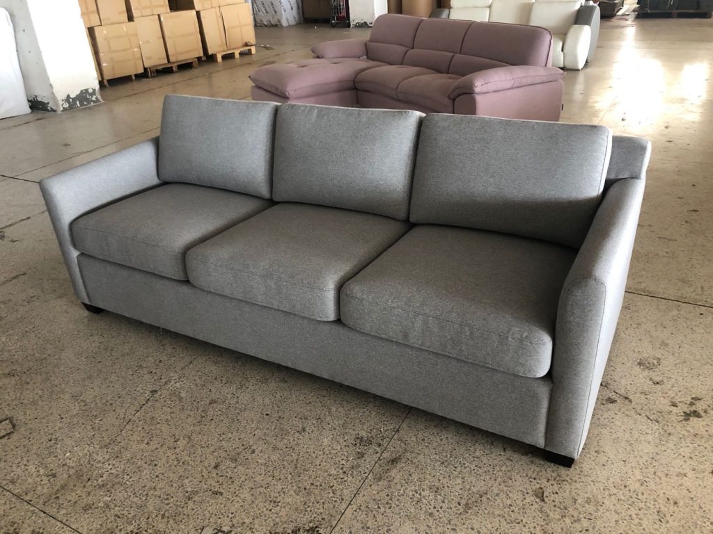 Finished upholstered sofa sample for a Canadian hotel guest-room program