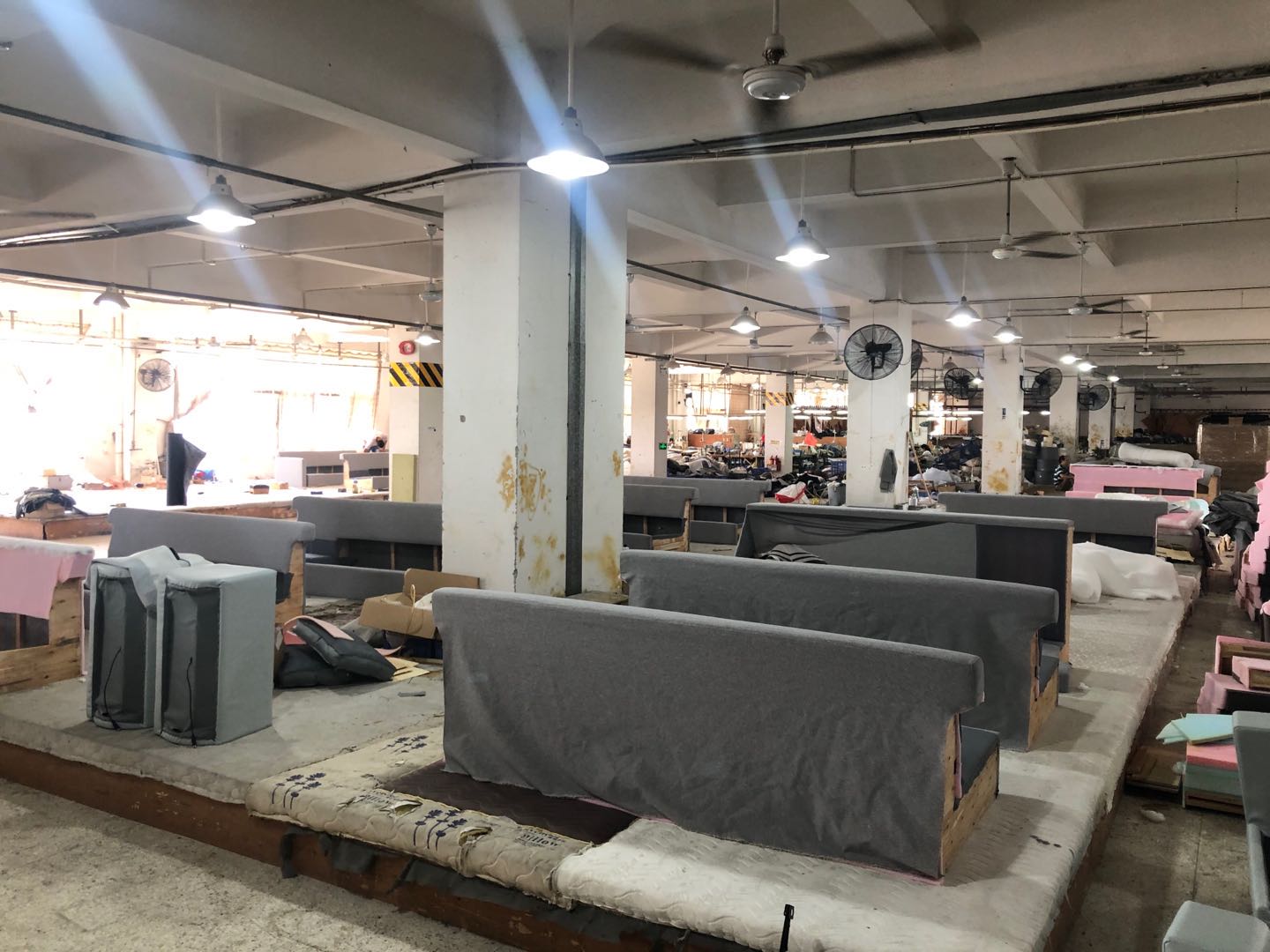 Upholstered sofa frames in assembly during Canadian hotel production