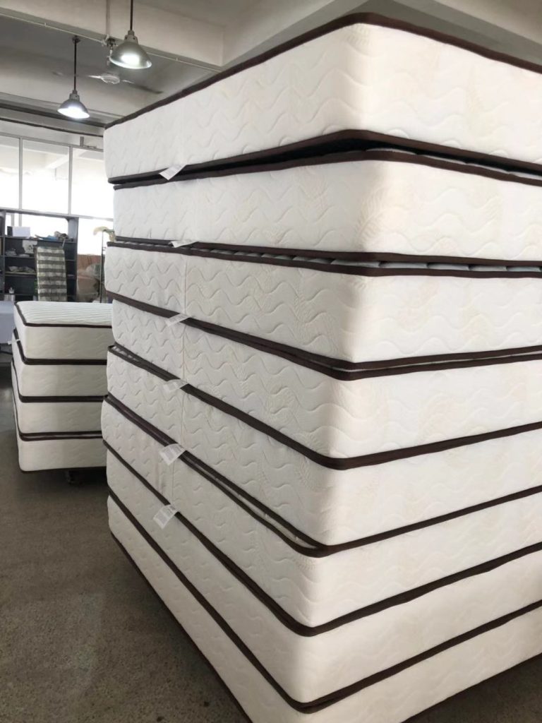 Finished mattress units staged during factory production