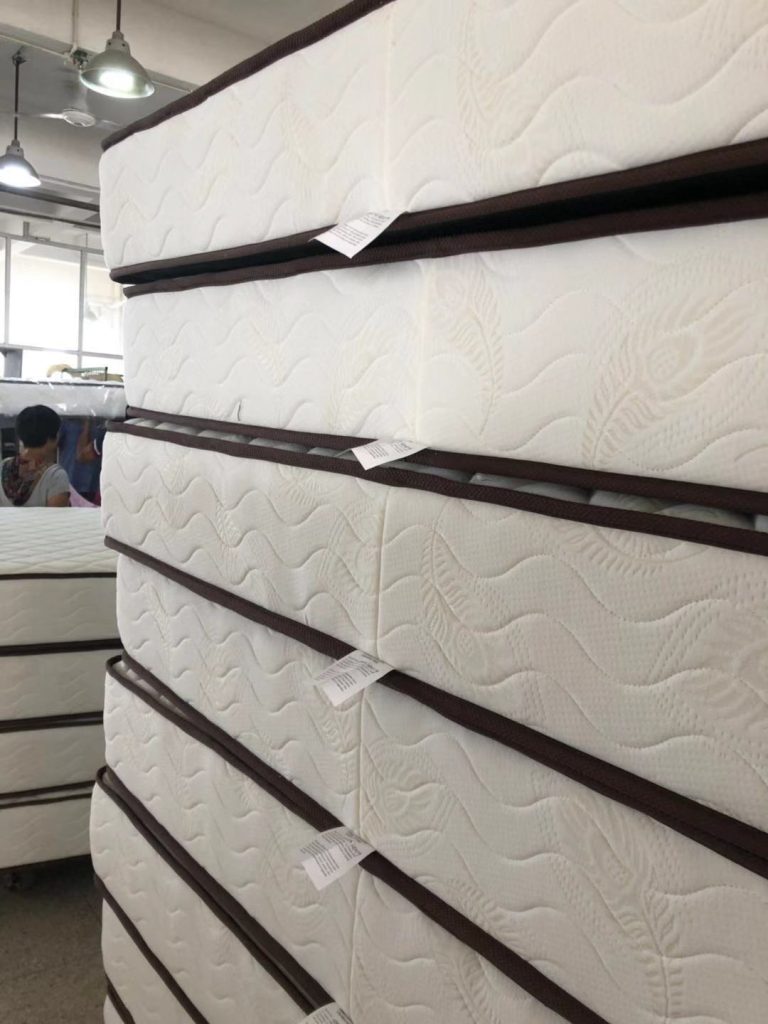 Stacked mattress production units awaiting packing and release checks