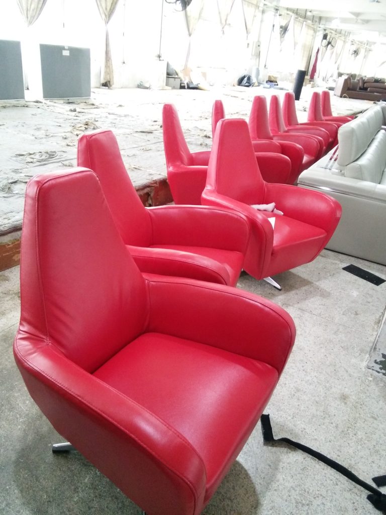 Custom red upholstered lounge chairs for a Vietnam hotel project