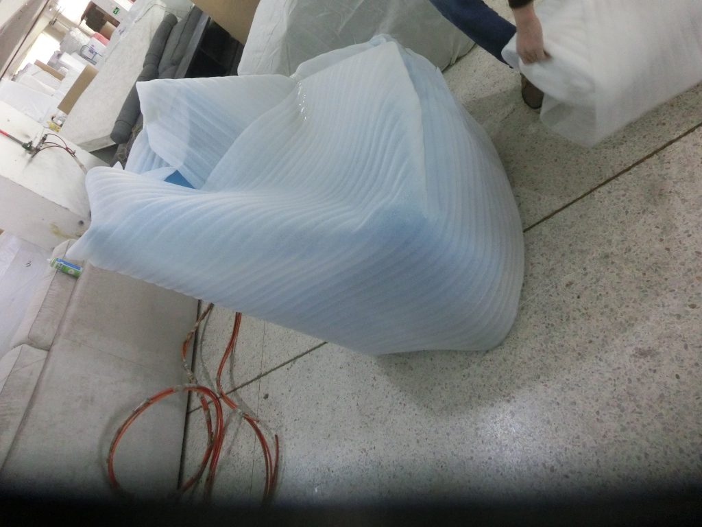 Upholstered hotel furniture protected with export packaging