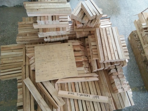 Marked timber components prepared for hotel furniture