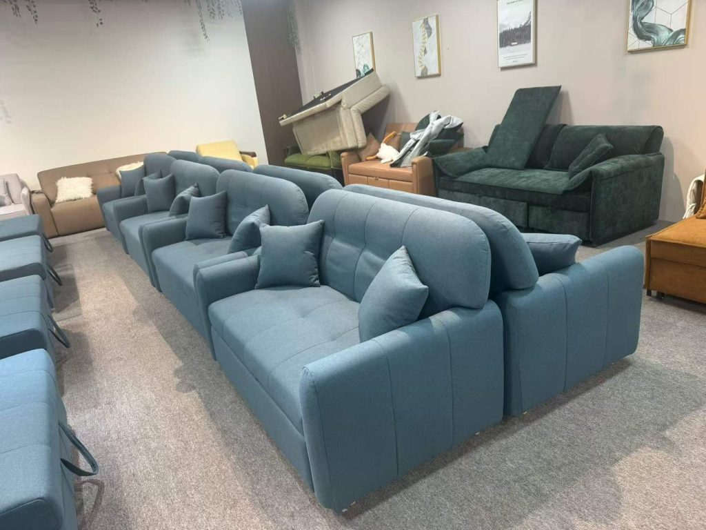 Blue-grey upholstered sofa beds shown together before final project approval